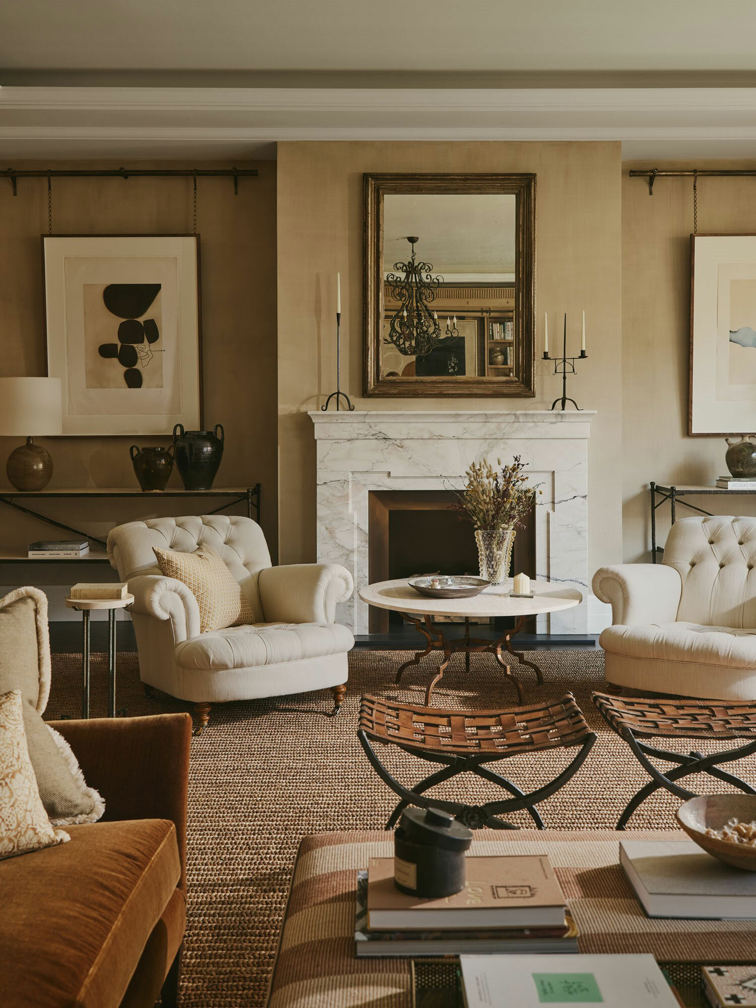 A large lounge interior with fireplace, furniture and opulent furnishings.