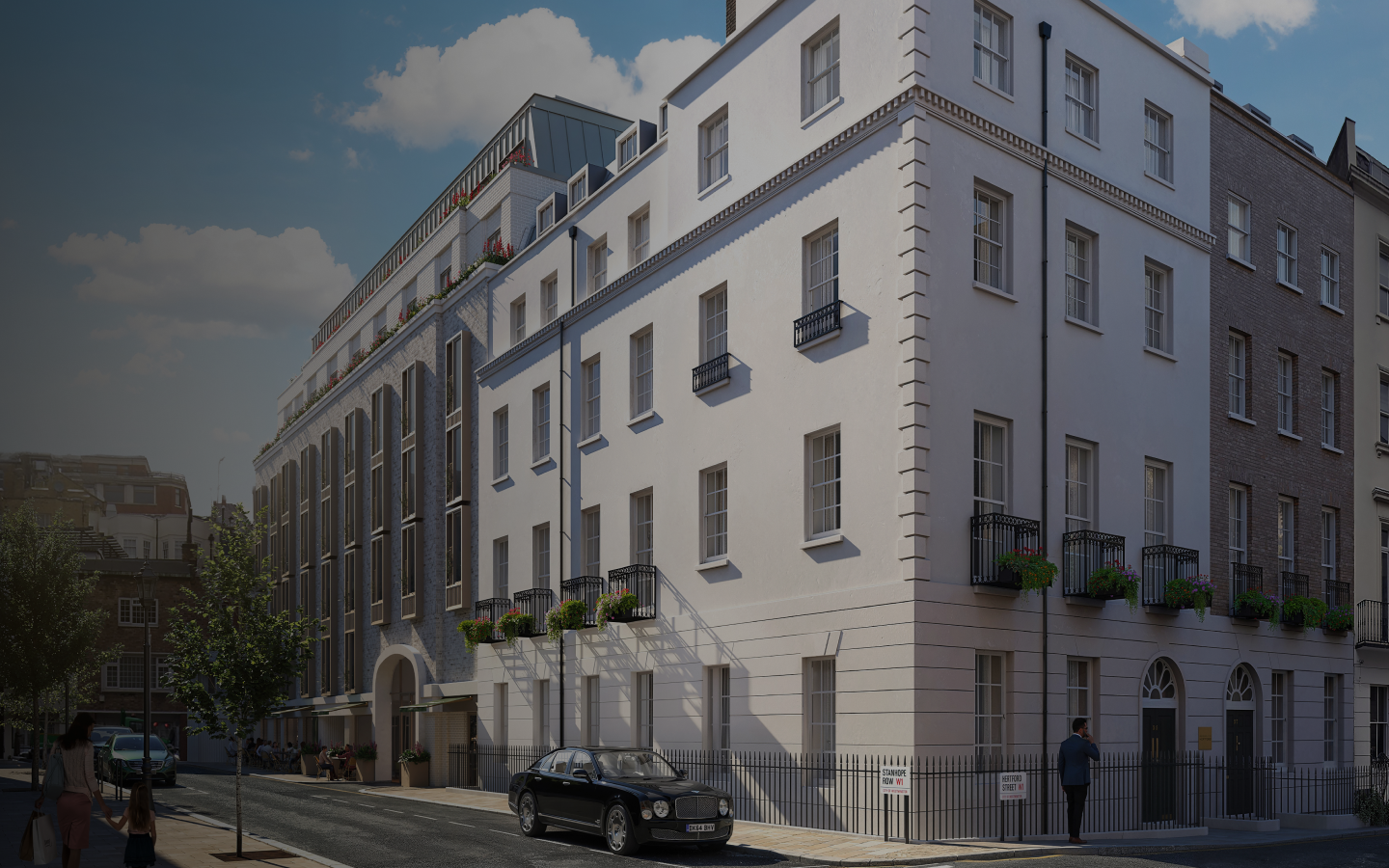 A crisp white building as viewed from the street