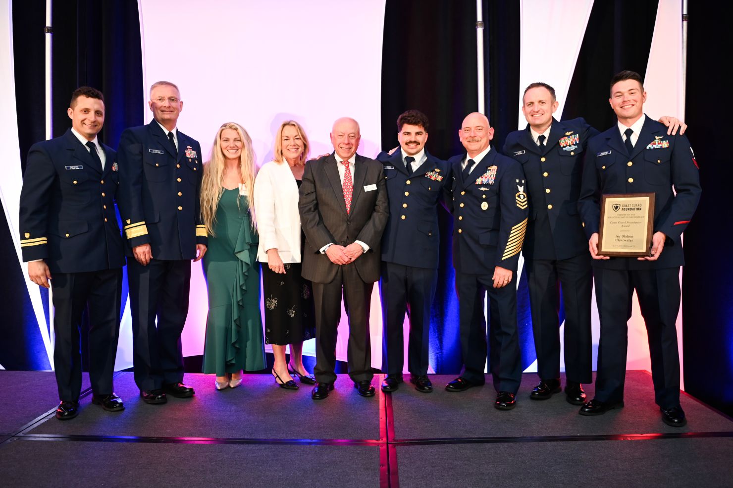 A group photo on stage.