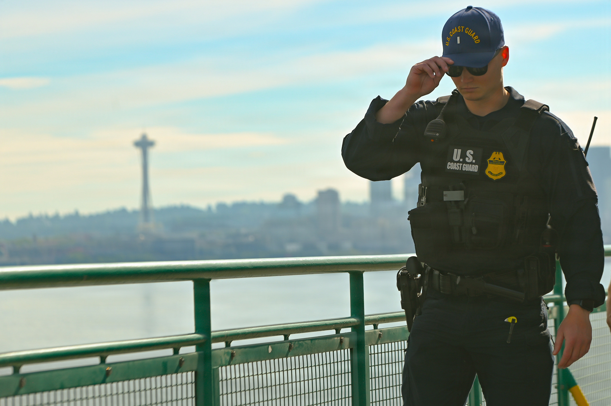 Coast Guard officer conducts a security sweep aboard a Washington State ferry near Seattle during FIFA World Cup 2026