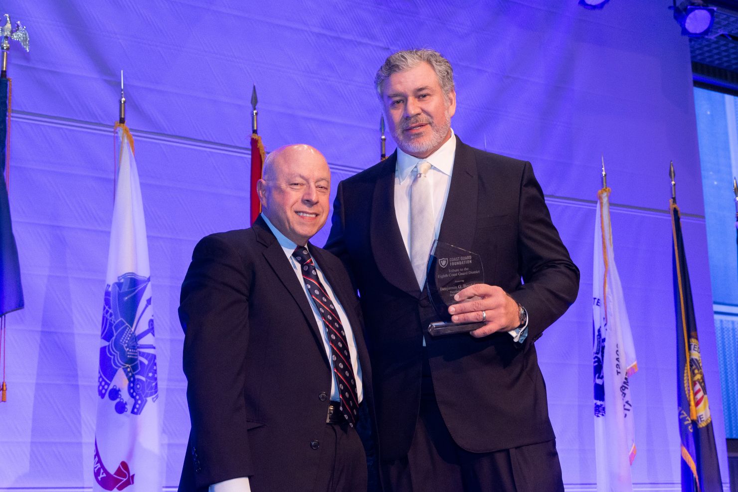 Two men standing on a stage