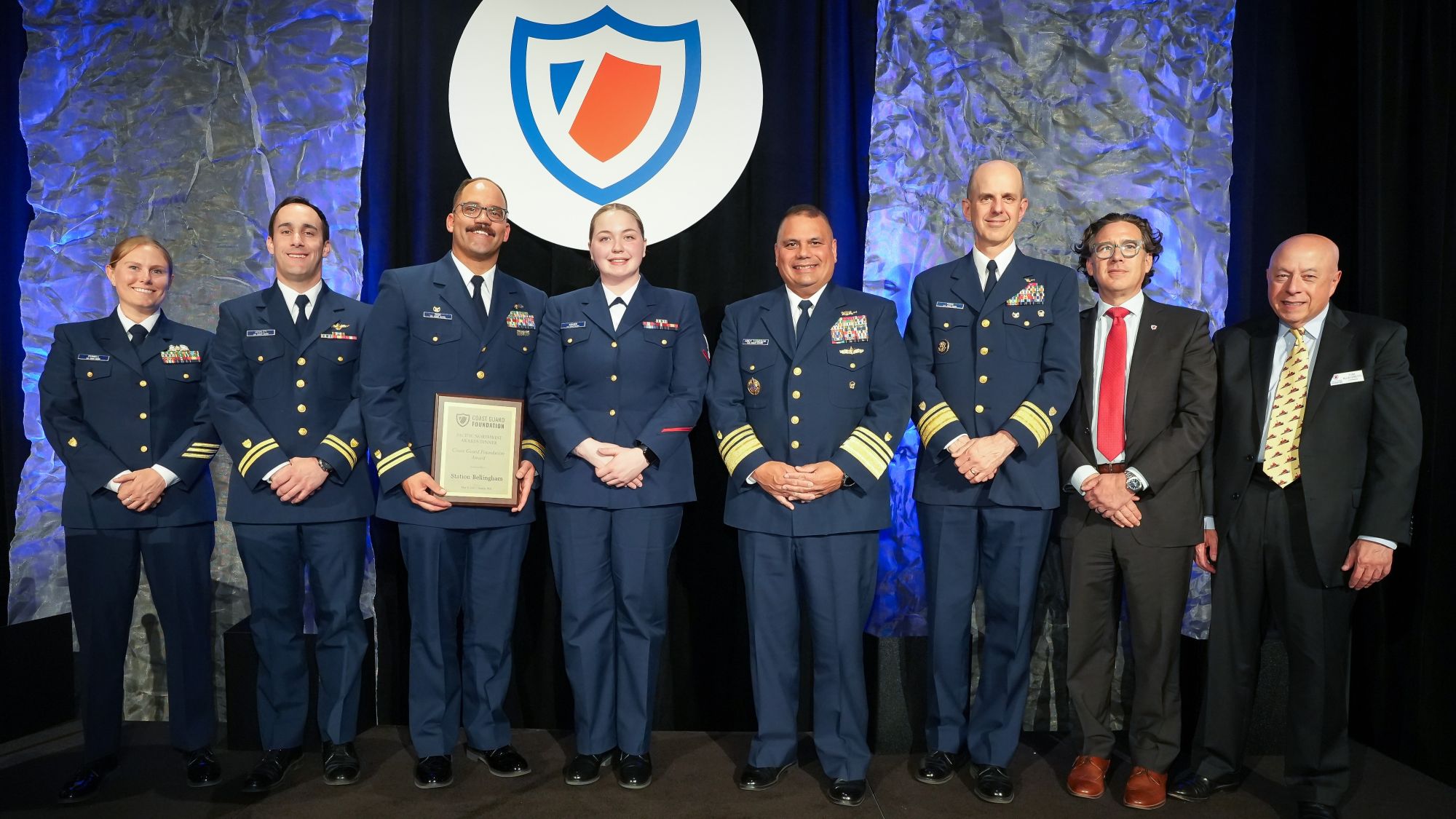Coast Guard members receiving an award.
