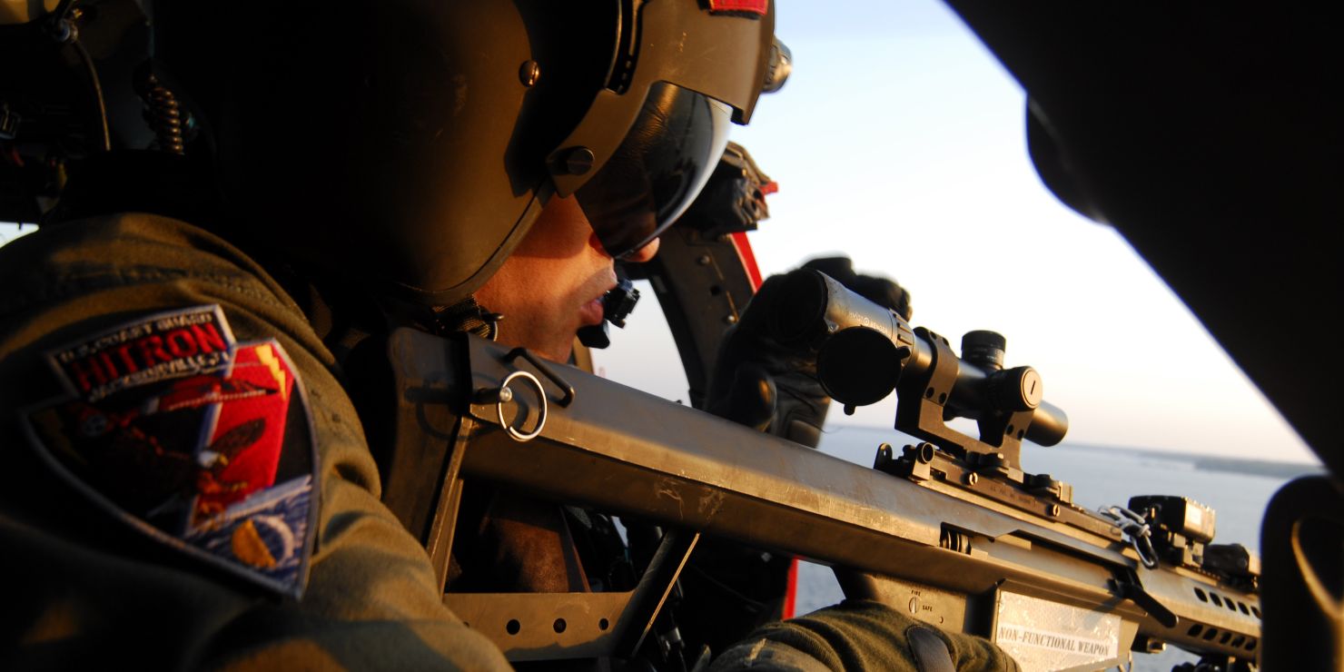 A Helicopter Interdiction Tactical Squadron marksman takes aim during training on the St. Johns River, Fla., March 26, 2008. (Coast Guard photograph by PA2 Bobby Nash)