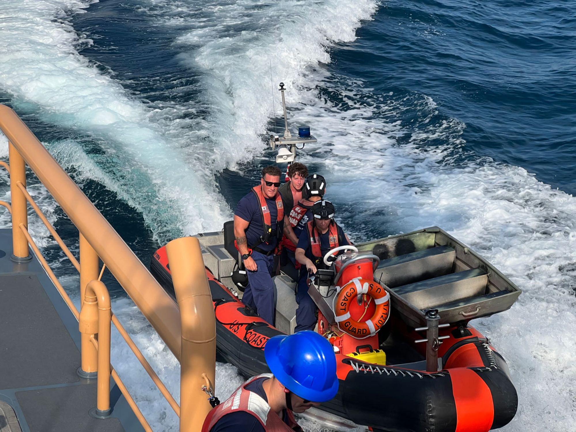 Coast Guard boat, crew and survivor