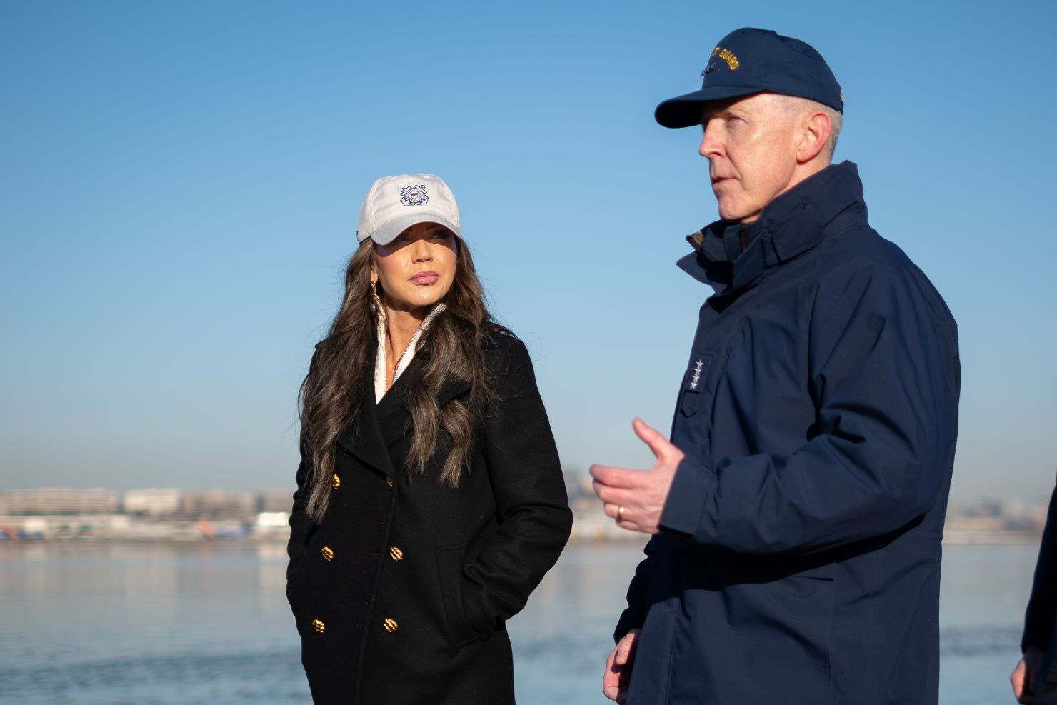 Two people talking with each other outside