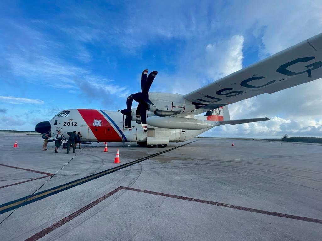 A Coast Guard airplane sitting on the tarmac