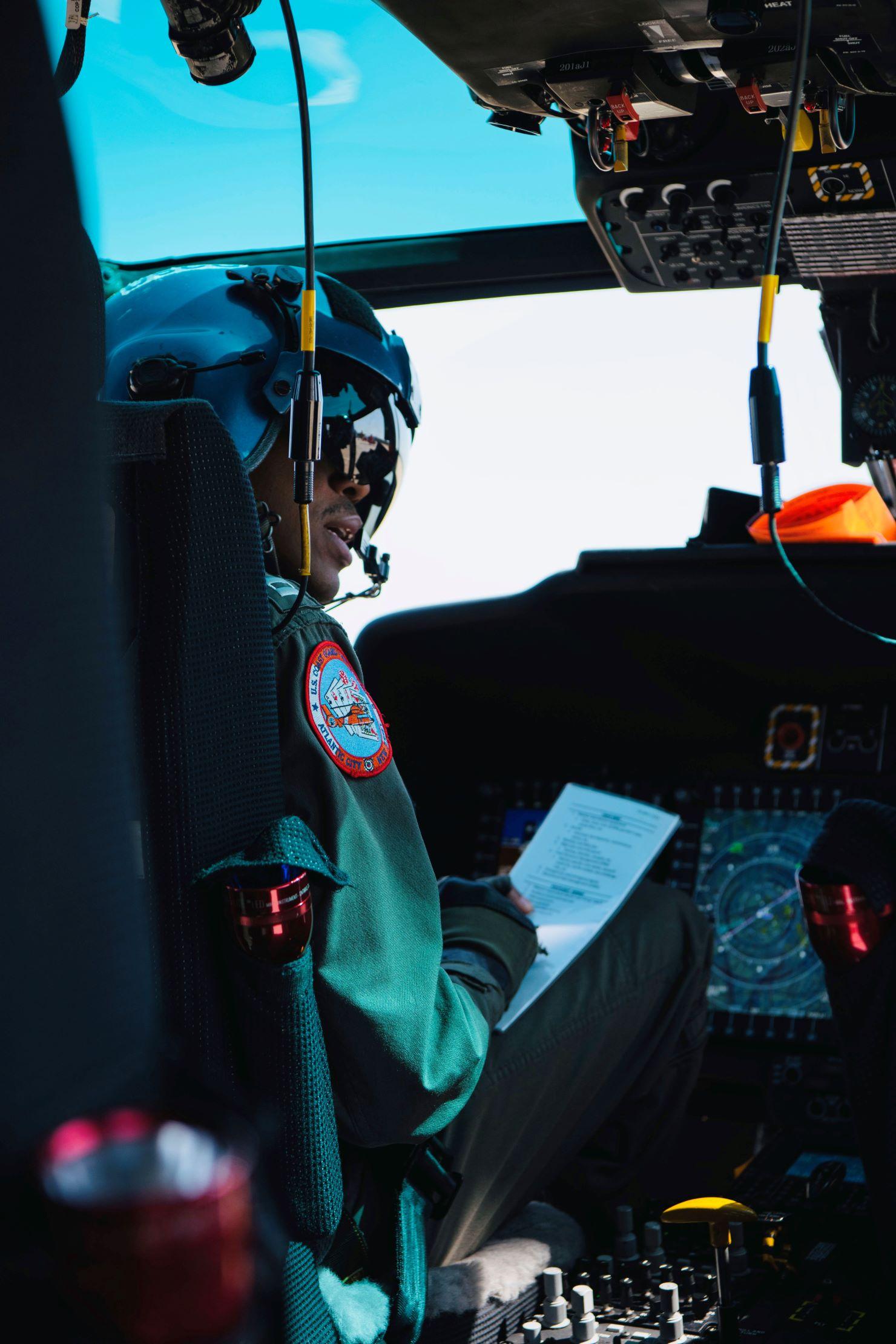 Helicopter pilot in a Coast Guard helicopter