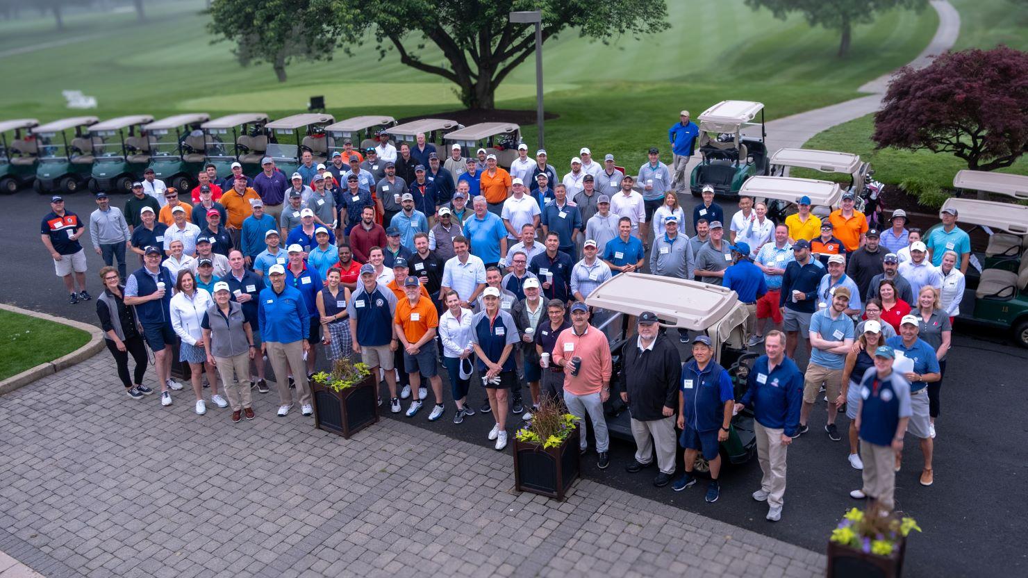 Golfers pose