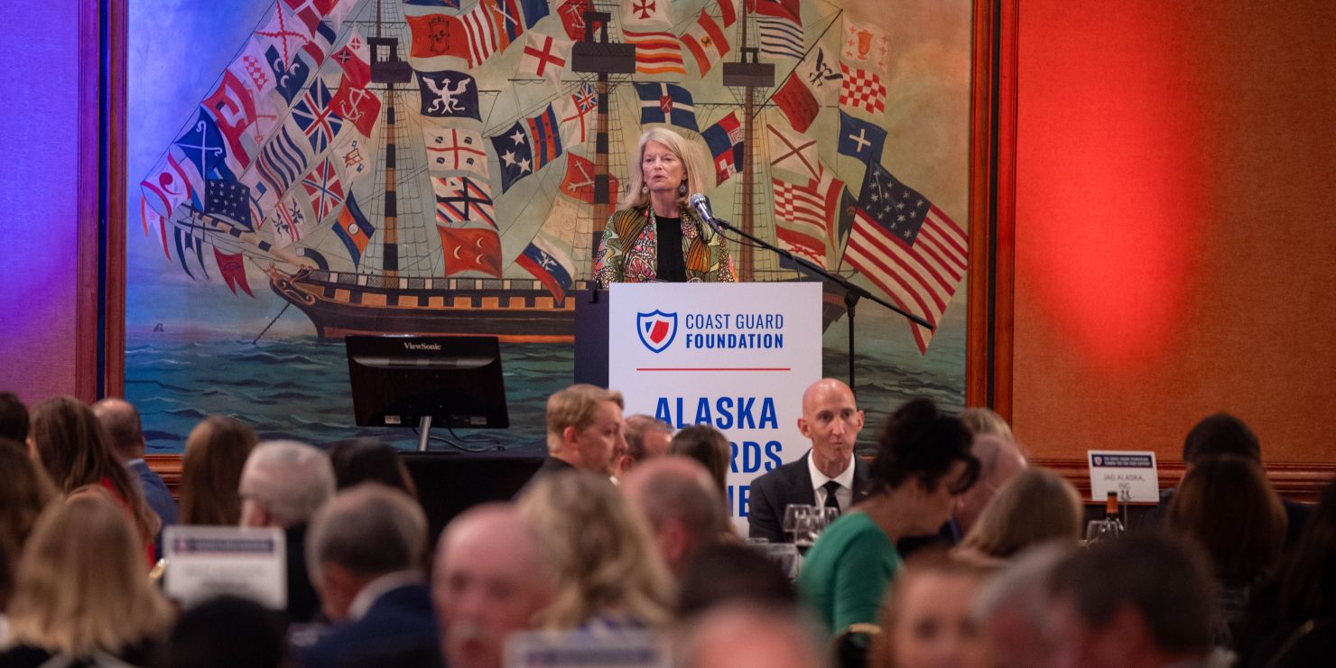 A woman at a podium.