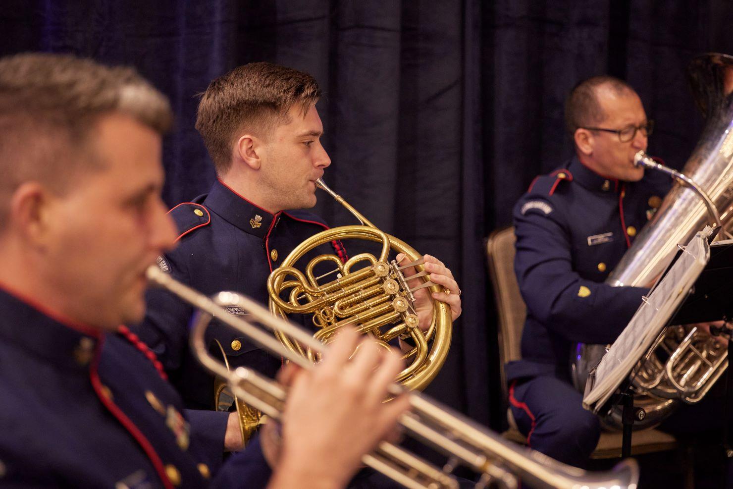 Horn players performing a musical number.