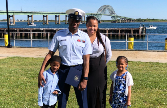 OLIVIA, COAST GUARD FOUNDATION SPOUSE GRANT RECIPIENT, WITH FIRST CLASS PETTY OFFICER JAMES B. AND THEIR CHILDREN.