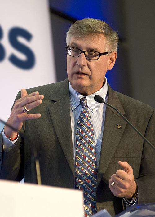 photo of Chris Wiernicki speaking at a podium.